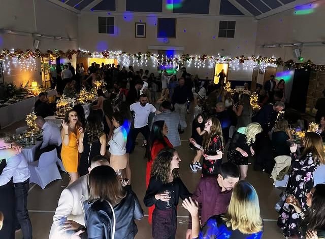 Packed function room dance floor